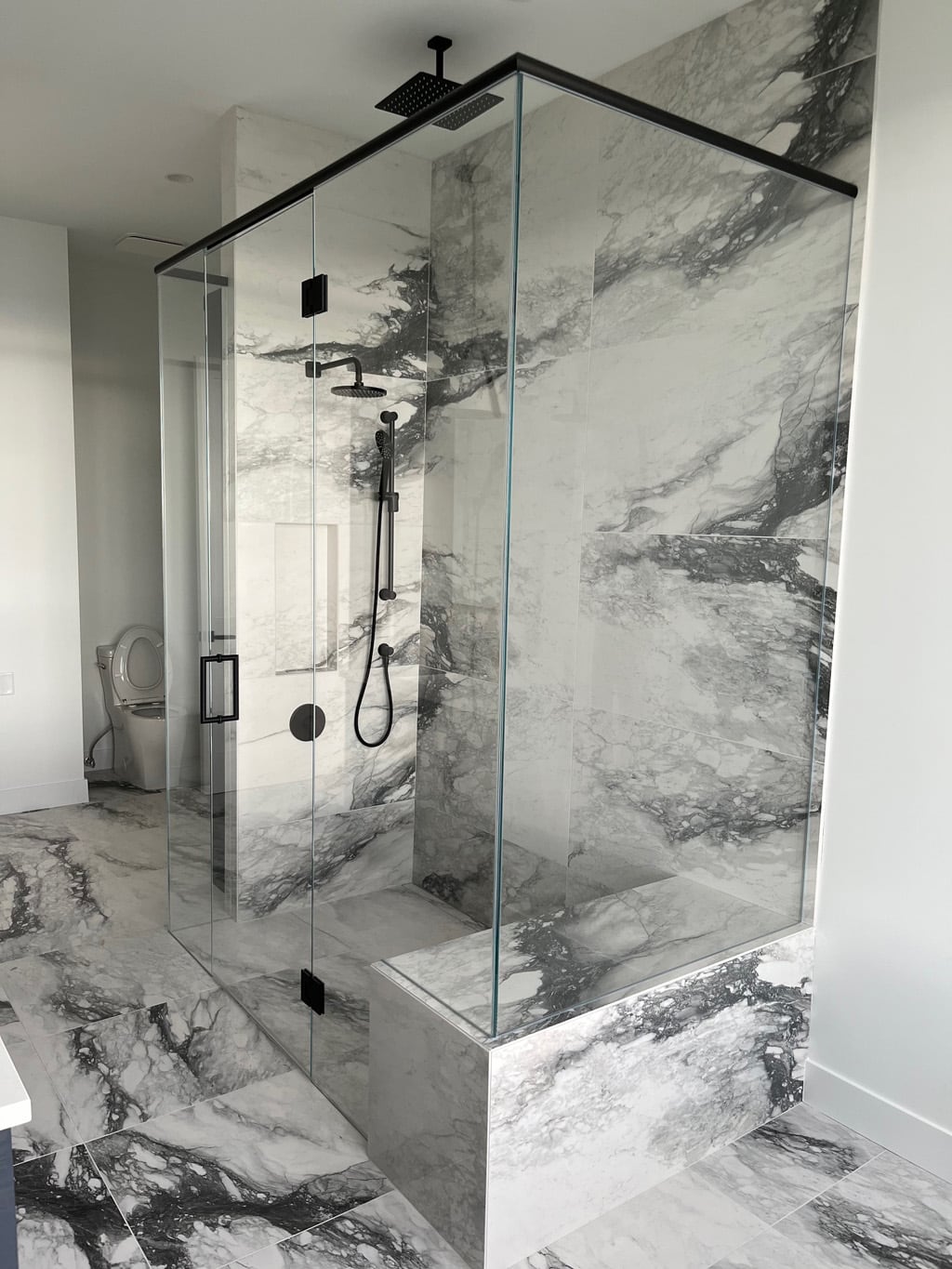 Glass shower enclosure